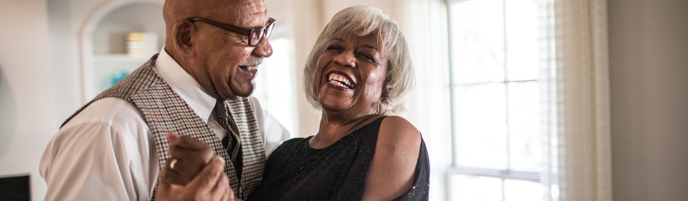 Senior Couple Dancing in Living Room